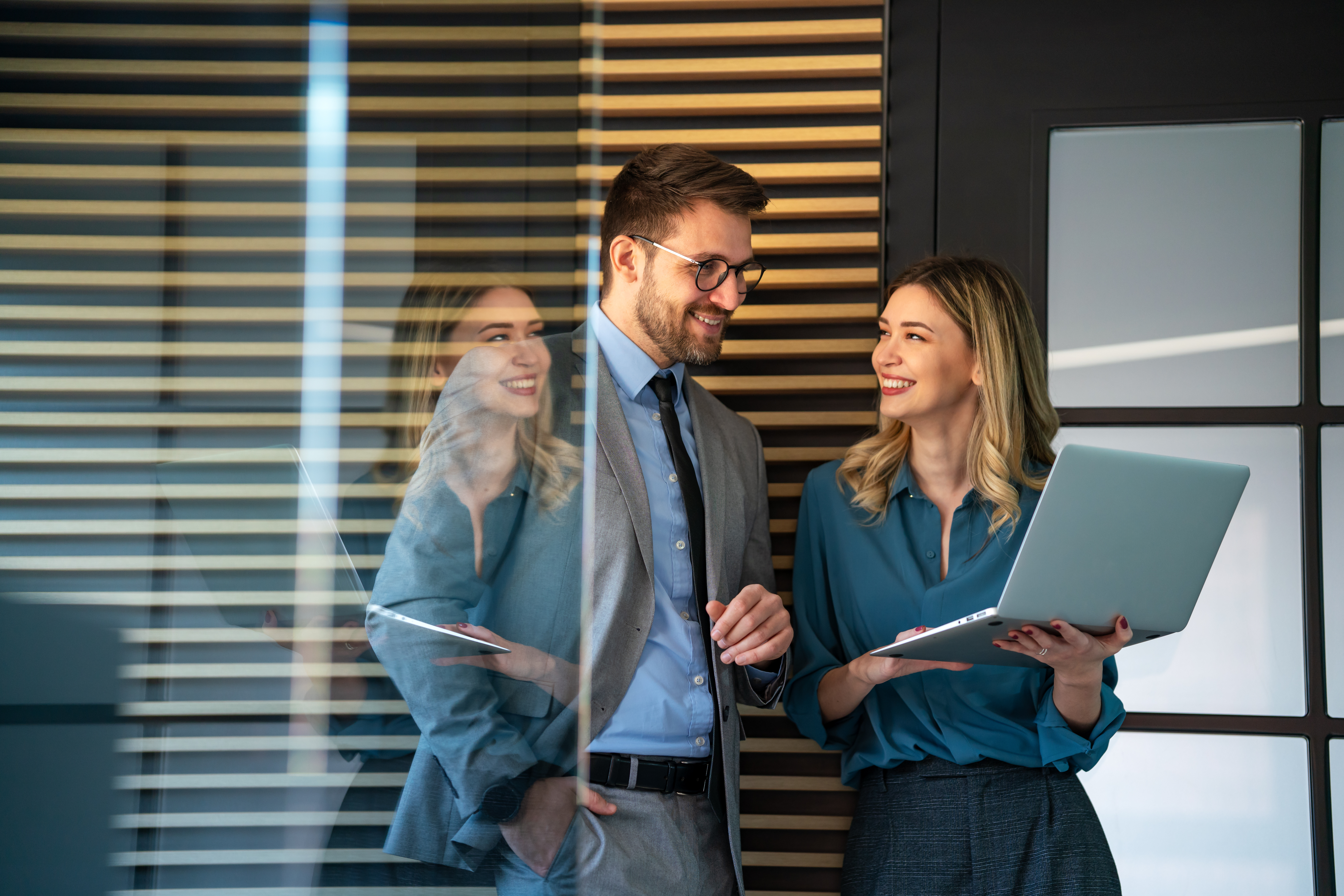 Happy colleagues after a successful ISO 27001 audit certification