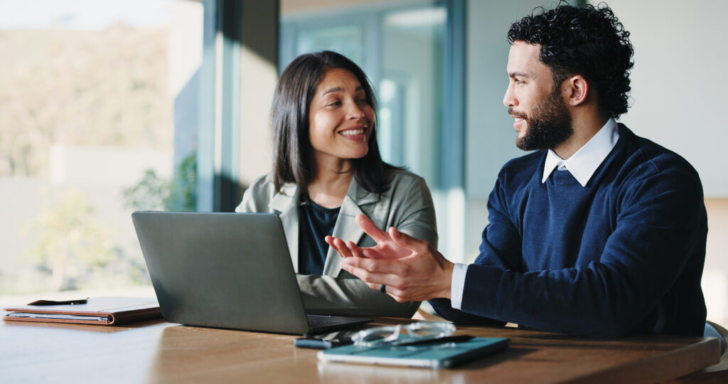 Real estate professionals discussing managed IT support and cyber security