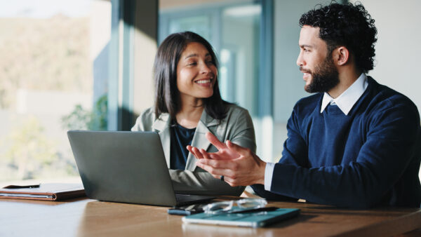 Real estate professionals discussing managed IT support and cyber security