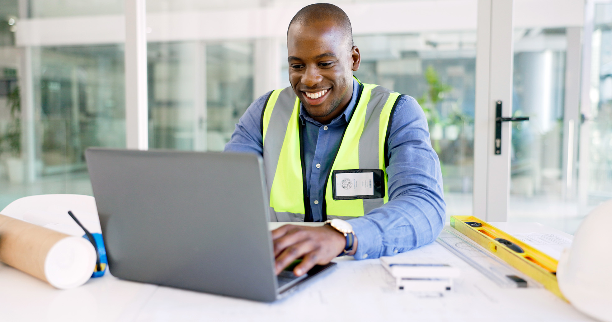 Construction professional using secure IT systems for project work