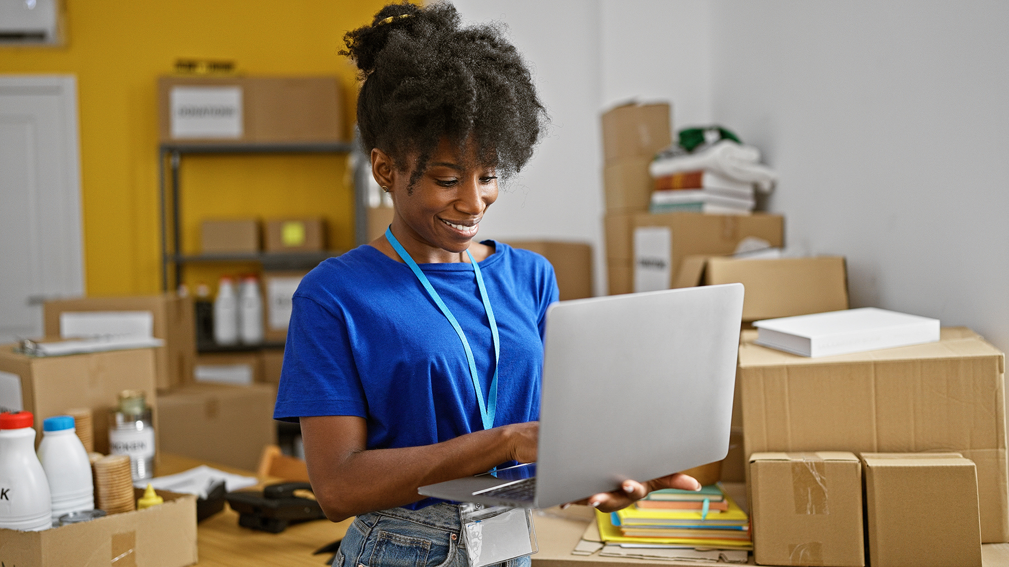 Charity employee using a tablet to manage day-to-day non-profit operations
